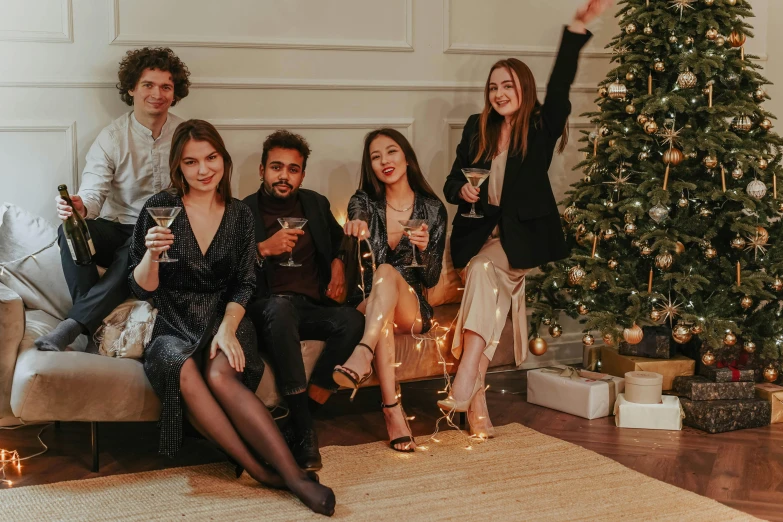 a group of people sitting around a christmas tree, a portrait, by Emma Andijewska, pexels contest winner, people drink cocktails, full body image, avatar image, thumbnail