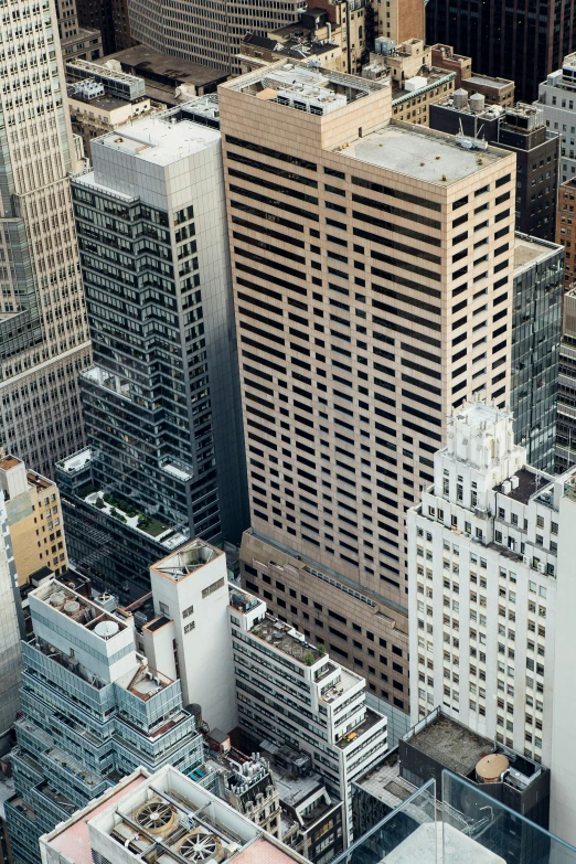 a view of a city from the top of a building, inspired by Thomas Struth, modernism, manhatten on top of skyscrapers, zoomed out to show entire image, art deco office buildings, single building