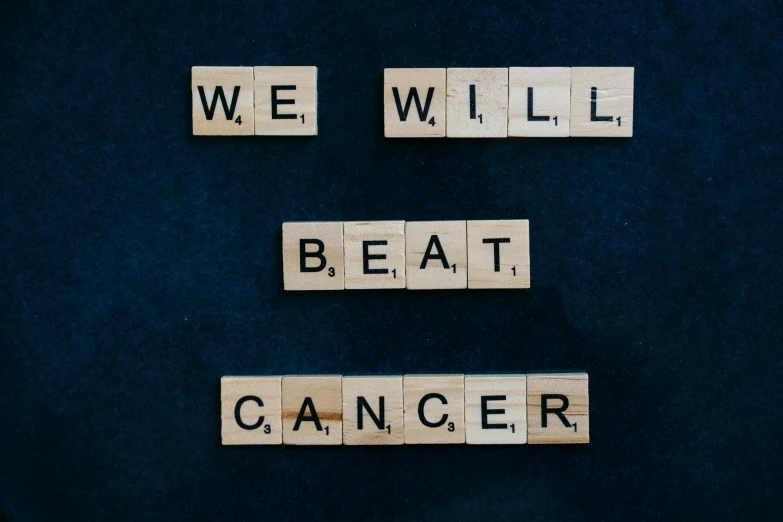 scrabbles spelling we will beat cancer on a blue background, by Caroline Mytinger, pexels contest winner, happening, background image, on black background, 1 6 x 1 6, a wooden