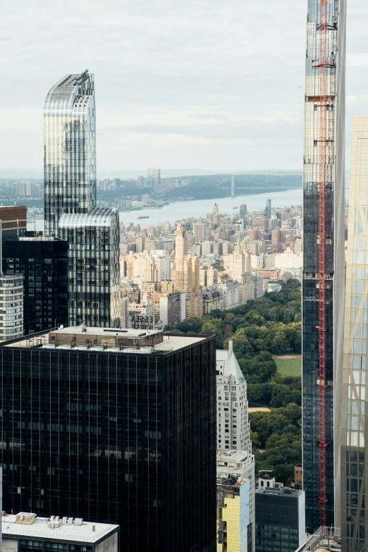 a view of a city from the top of a building, slide show, trump tower, from the side, central park