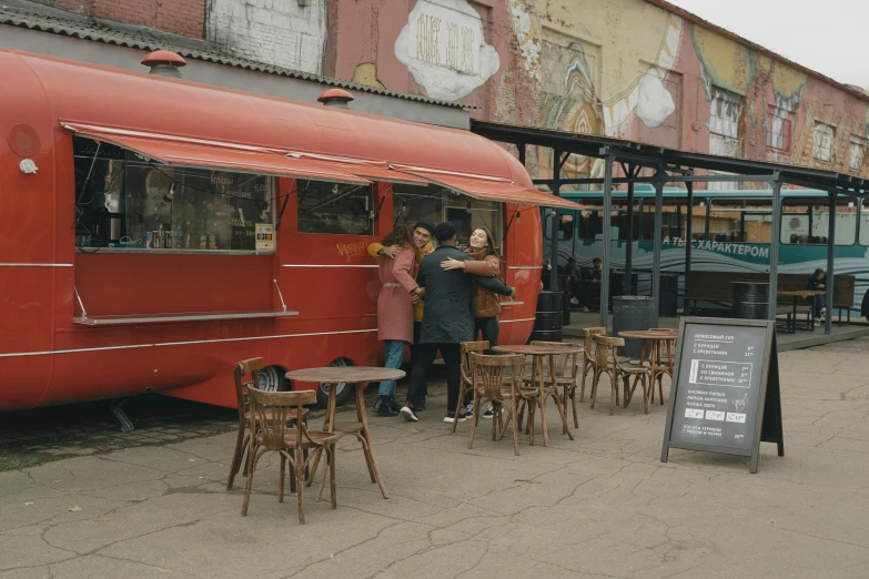 a group of people standing in front of a food truck, post - soviet courtyard, cinematic, brown, 15081959 21121991 01012000 4k