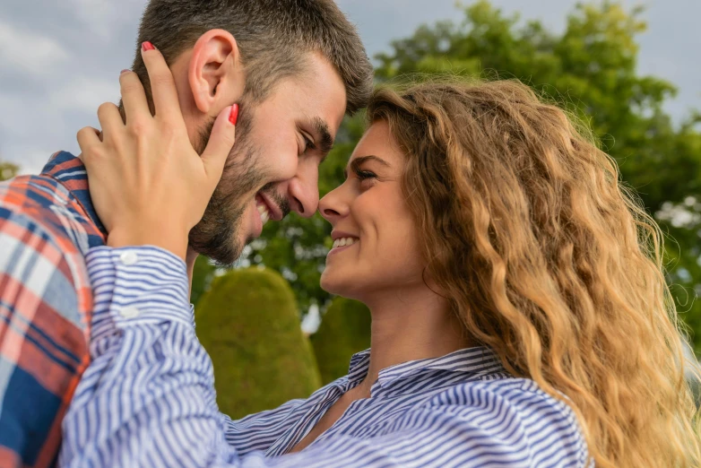 a man and woman looking into each other's eyes, a photo, trending on pixabay, smiling :: attractive, promo image, turning her head and smiling, outdoor photo