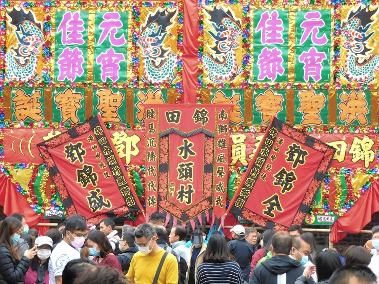 a large group of people standing next to each other, pexels, sōsaku hanga, red banners, a still of kowloon, avatar image, decorations