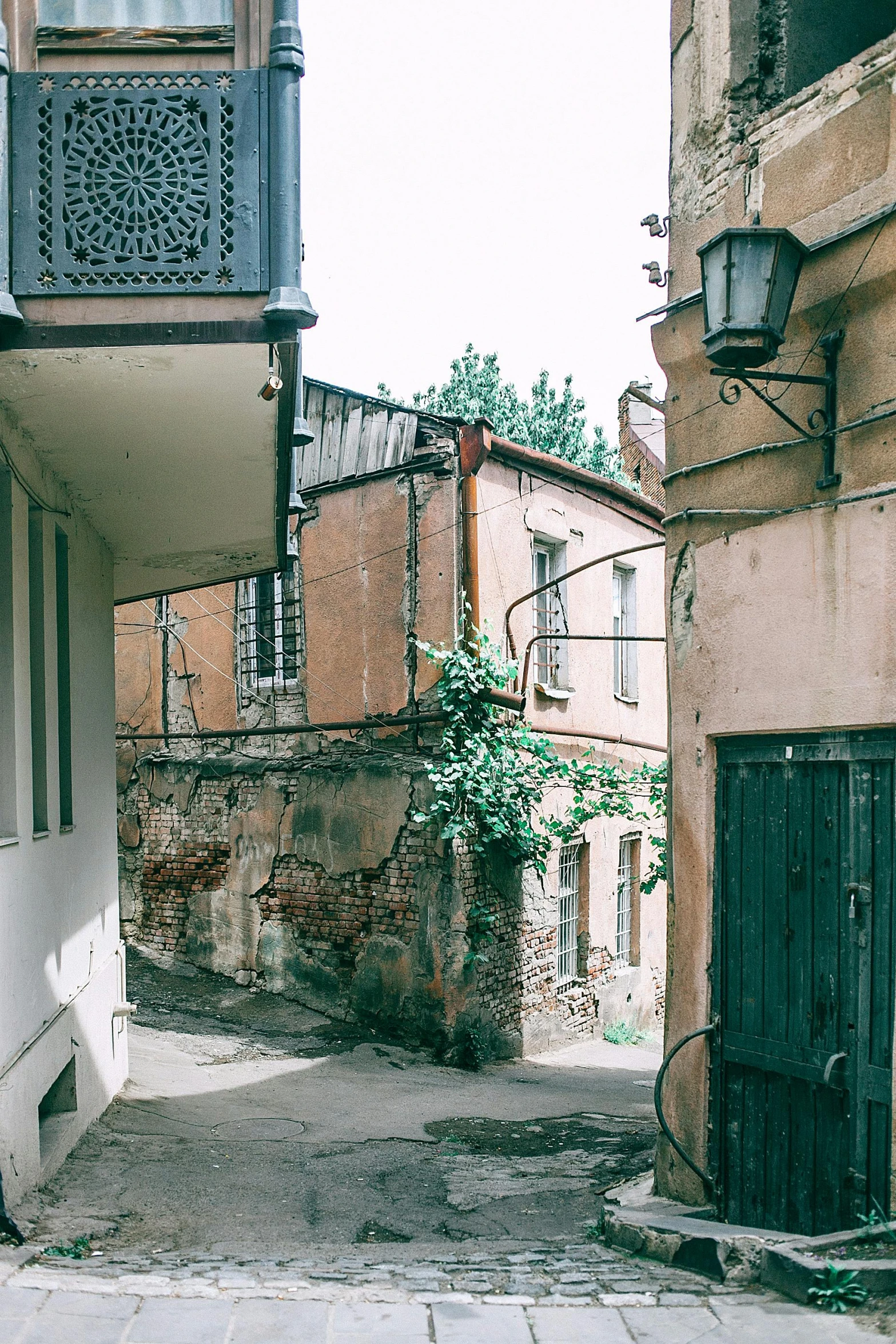 a couple of buildings that are next to each other, a picture, by Lucia Peka, pexels contest winner, renaissance, shady alleys, panoramic, well worn, 35mm of a very cute