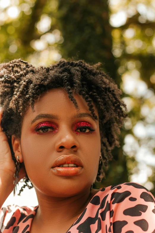 a close up of a person holding a cell phone, an album cover, by Winona Nelson, trending on pexels, renaissance, natural hair, ((red)) baggy eyes, model shoot, square