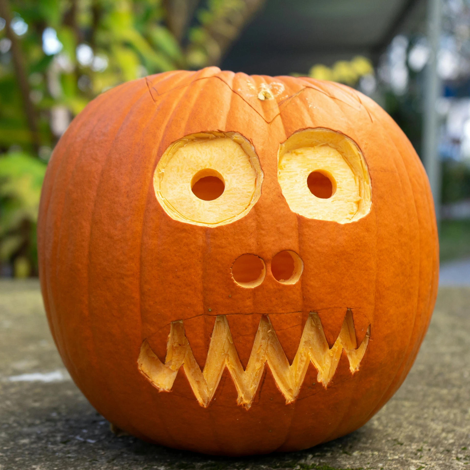 a pumpkin with a face carved into it, inspired by Edward Baird, mingei, three eyed, looking towards camera, cast, 2 0 5 6