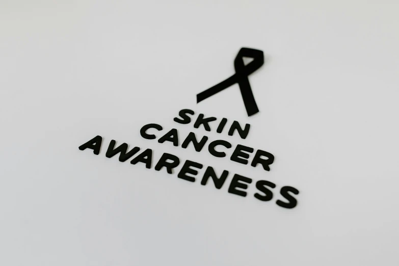 a black and white sign that says skin cancer awareness, by Emma Andijewska, stickers, 3 d logo, skin care, 3 4 5 3 1