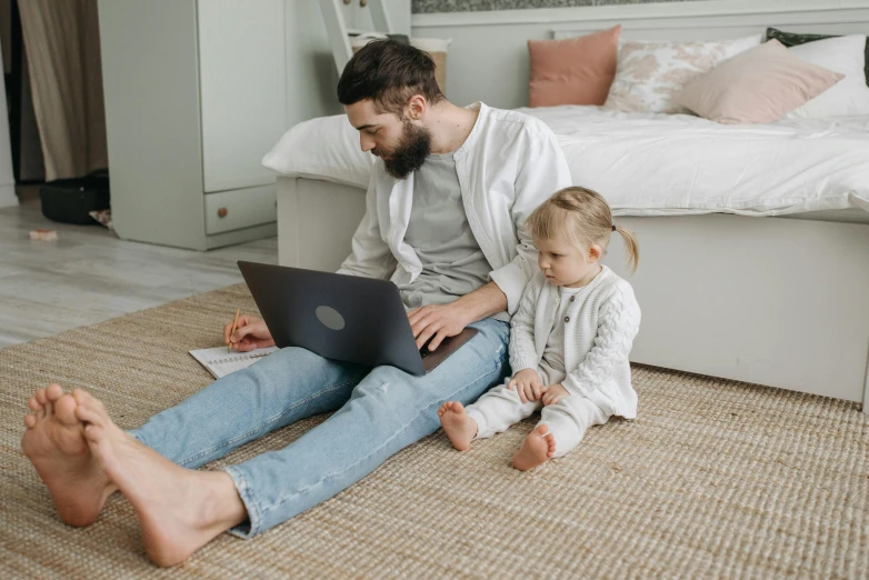 a man and a little girl sitting on the floor with a laptop, pexels contest winner, avatar image, bearded, father with child, 1 2 9 7
