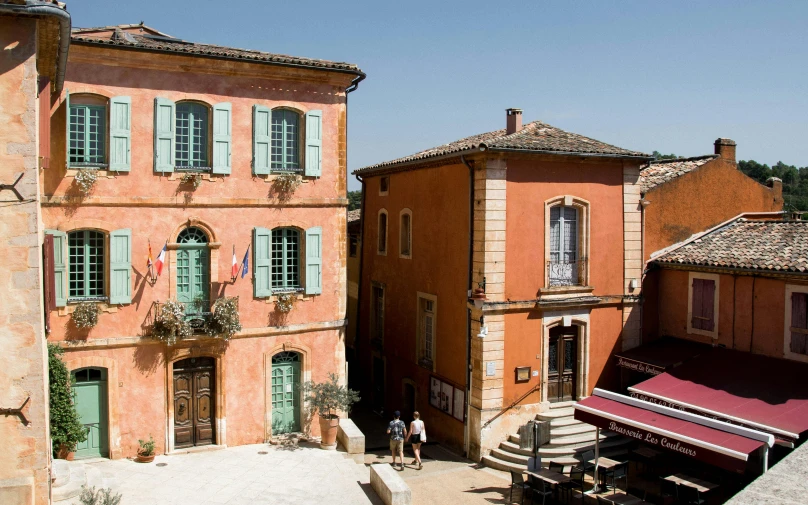 a couple of buildings that are next to each other, inspired by François Girardon, pexels contest winner, renaissance, lourmarin, red building, movie set”, wide high angle view