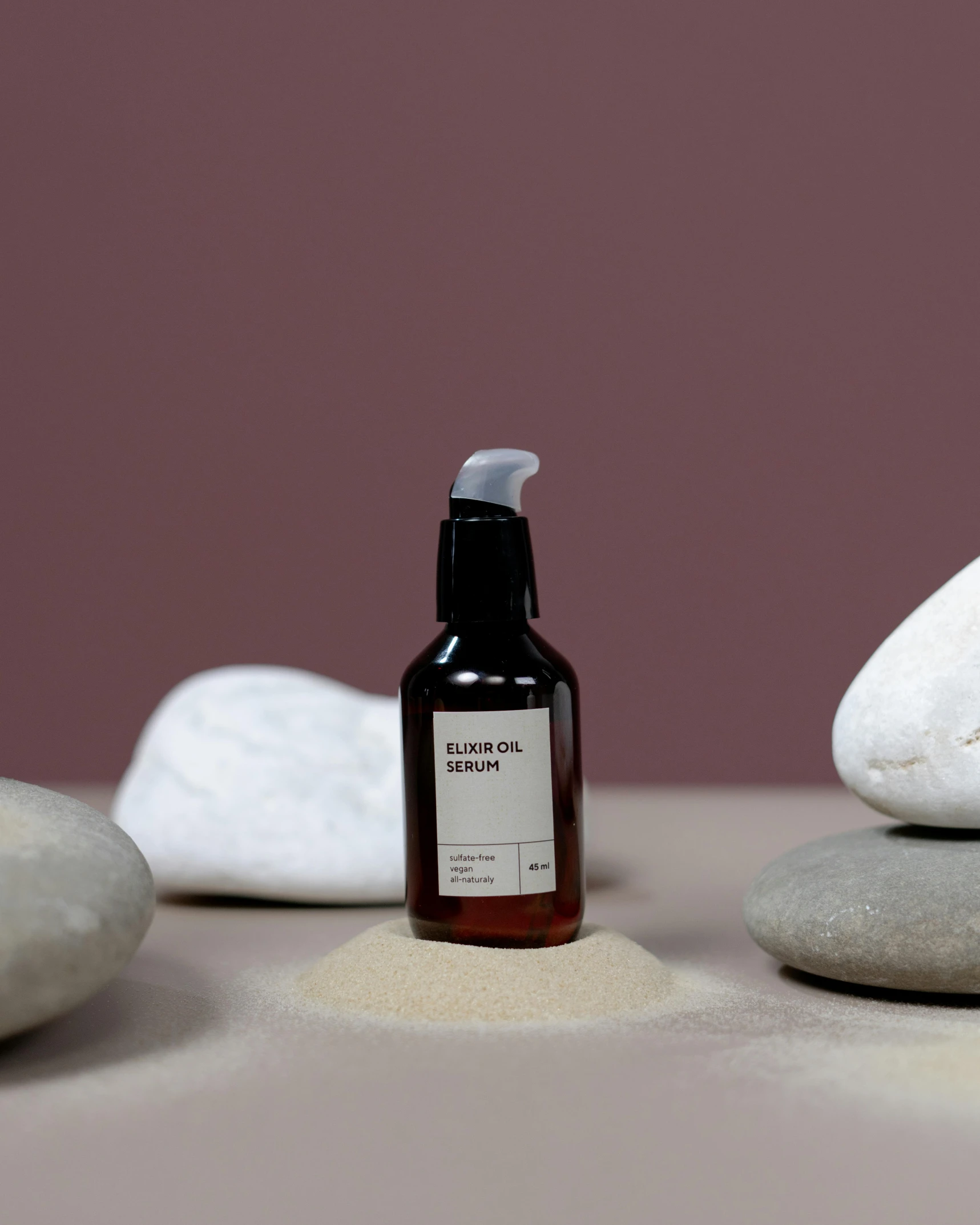 a bottle of liquid sitting on top of a pile of rocks, inspired by Évariste Vital Luminais, unsplash, full view of face and body, black fine lines on warm brown, japanese collection product, panel