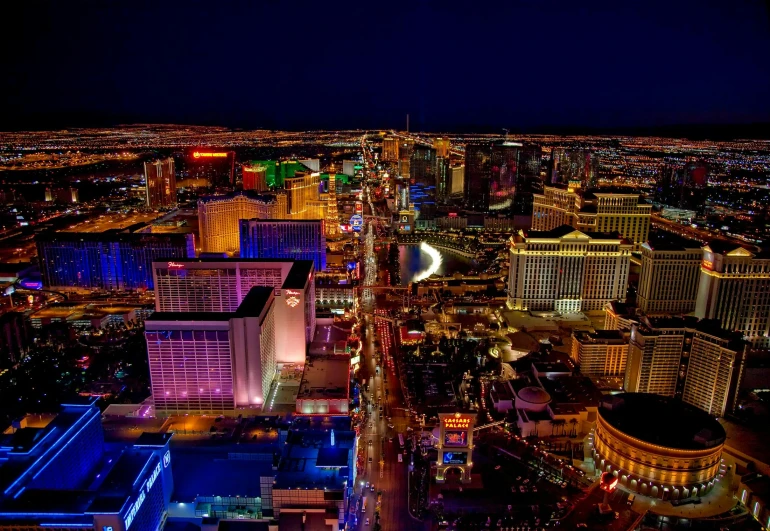 an aerial view of a city at night, sin city, fan favorite, night clubs and neons, vacation photo