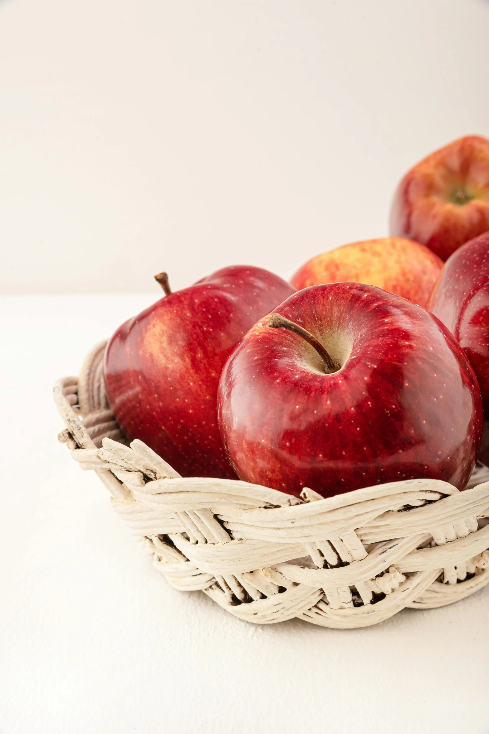 a basket of apples sitting on top of a table, high quality product photography, zoomed in, e621, candy apple