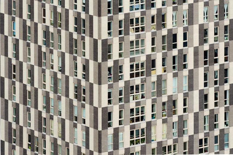 a very tall building with lots of windows, unsplash contest winner, photorealism, ignant, abstract blocks, peter guthrie, patterned