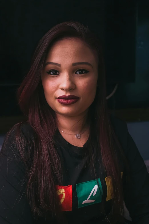 a woman with long red hair wearing a black shirt, mixed race woman, lipstick, riyahd cassiem, light skin