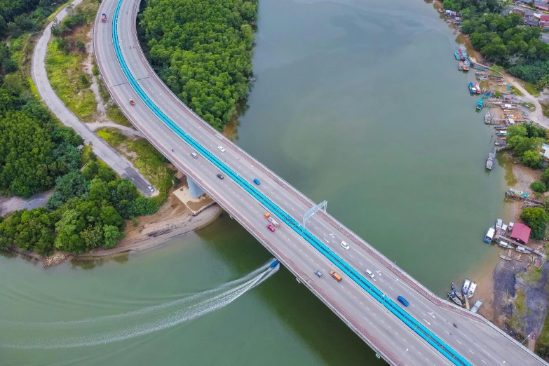 an aerial view of a bridge over a river, by Bernardino Mei, pexels contest winner, hurufiyya, malaysian, advanced highway, thumbnail, high quality upload