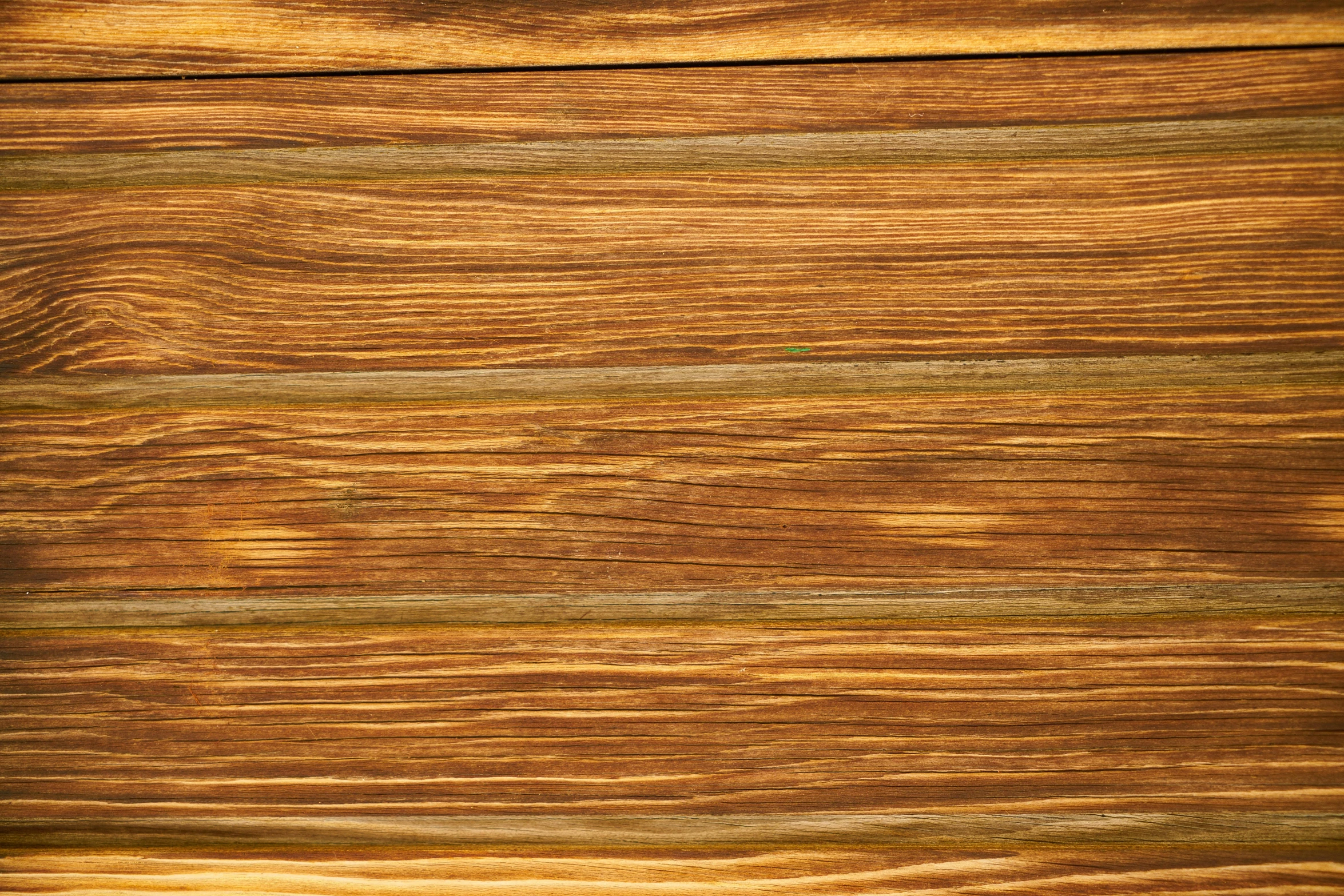 a close up of a wooden surface, by Jakob Häne, flax, golden glow, striped, mawshot