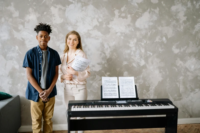 a couple of people standing next to a piano, educational, gen z, portait image