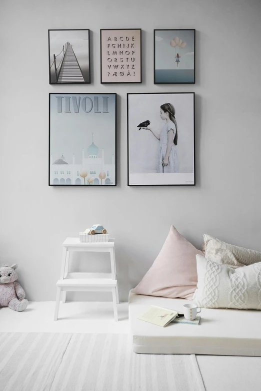 a child's room with white walls and pictures on the wall, poster art, trending on pexels, visual art, sitting on a stool, teenage girl, light grey backdrop, cushions