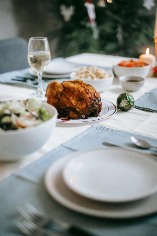 a close up of a plate of food on a table, by Carey Morris, pexels contest winner, renaissance, chicken, holiday, white table, full body image