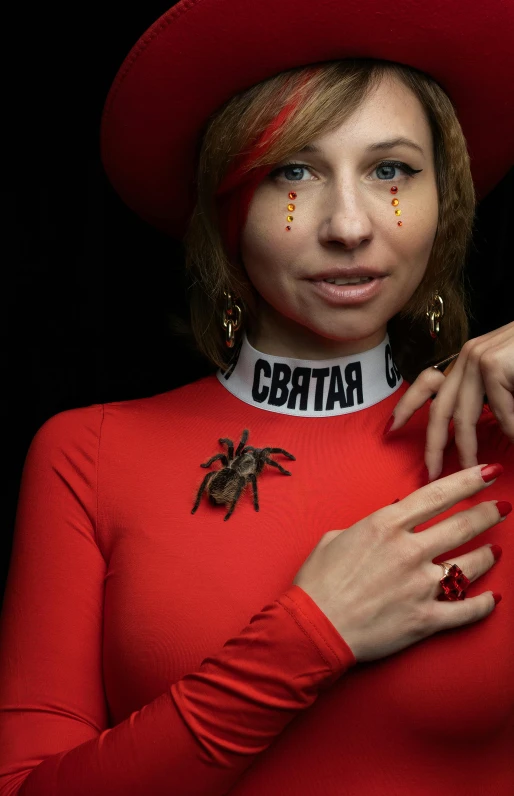 a woman wearing a red top and a red hat, an album cover, inspired by Julia Pishtar, antipodeans, spider, cosplay photo, maya bee, ((zerator))