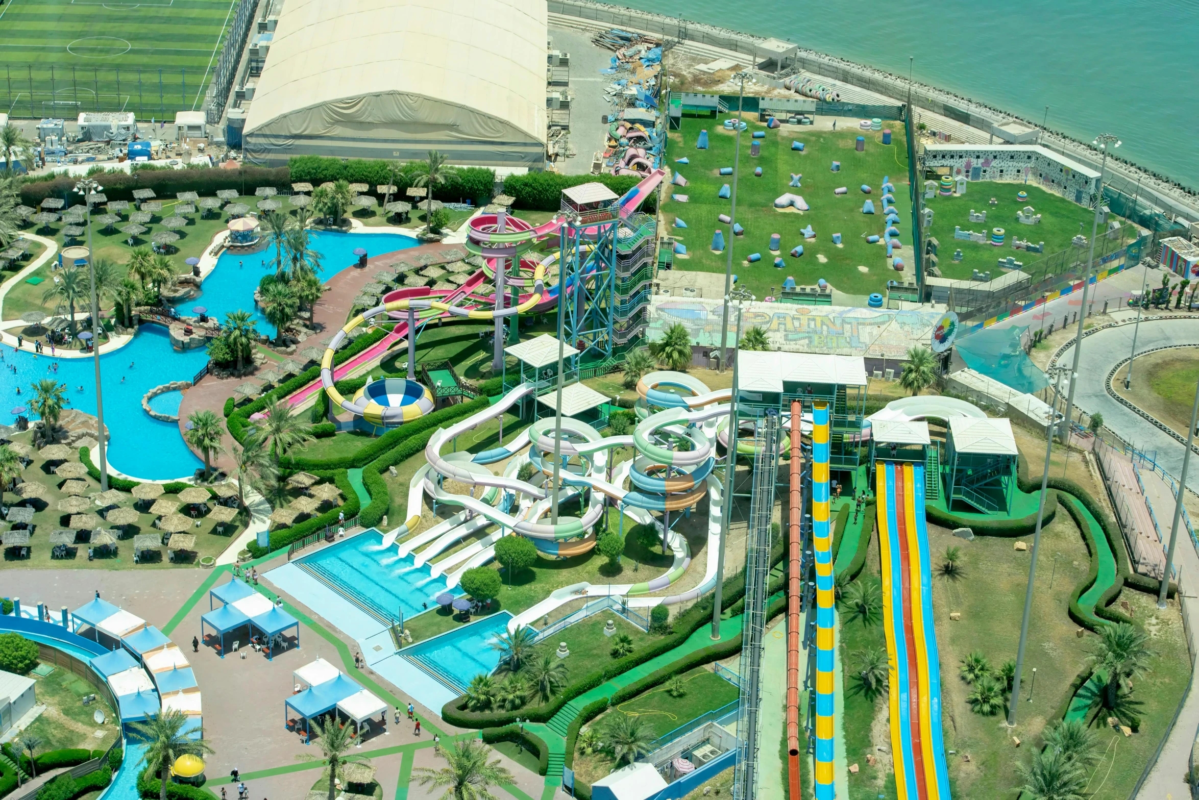 an aerial view of a large water park, by Emanuel Witz, hurufiyya, vista view, view from high, aquamarine, complex background