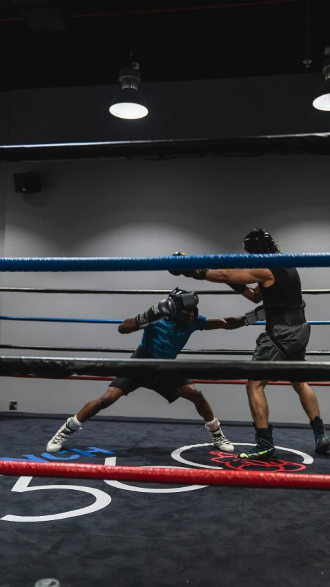 a couple of men standing next to each other in a boxing ring, by Robbie Trevino, pexels contest winner, happening, square, air is being pushed around him, flattened, high quality photo