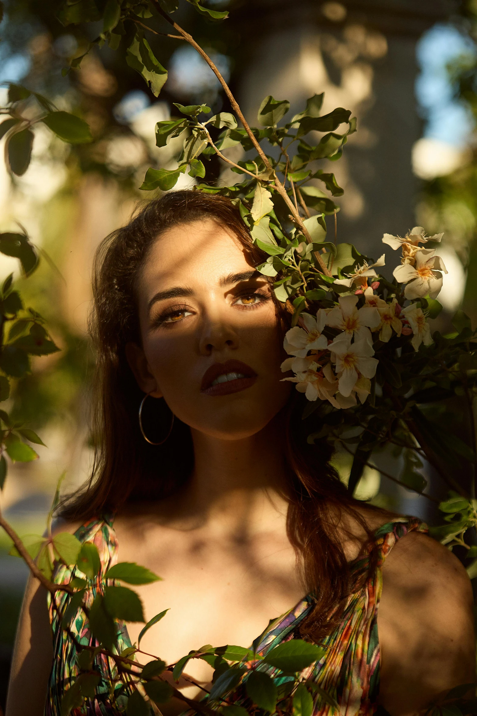 a woman with a flower crown on her head, an album cover, inspired by Elsa Bleda, unsplash, photorealism, charli xcx, gorgeous sunlight and shadows, lush foliage, 5 0 0 px models