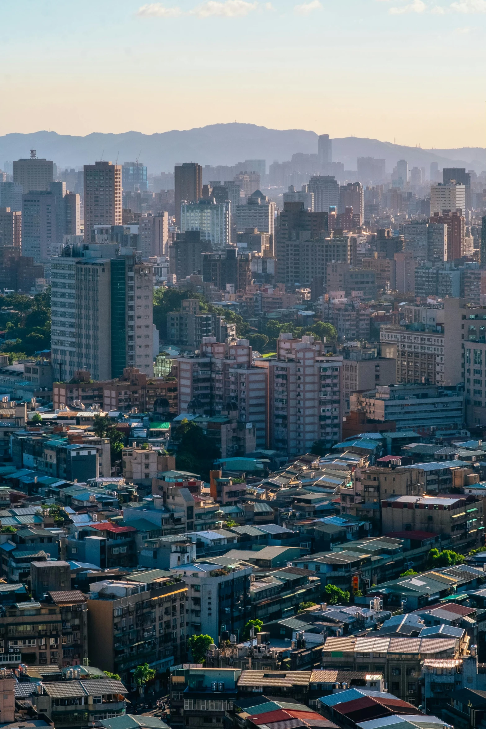 a large city filled with lots of tall buildings, pexels contest winner, taiwan, sparsely populated, chile, late afternoon