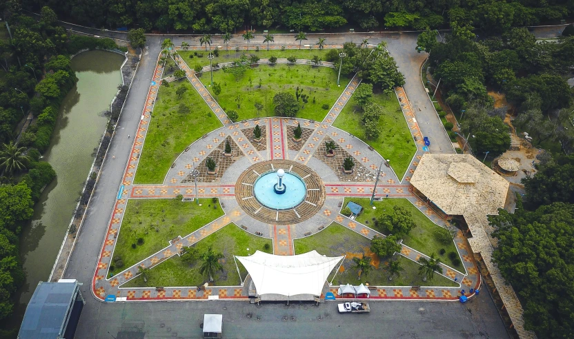 an aerial view of a park with a fountain, pexels contest winner, quito school, avatar image, sunken square, video