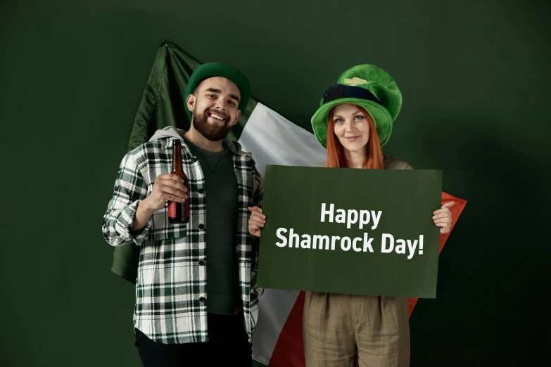 a man and a woman holding a sign that says happy shamrock day, a photo, by Elaine Hamilton, shutterstock contest winner, hurufiyya, instagram post, ( ( dark green, prop rocks, beer