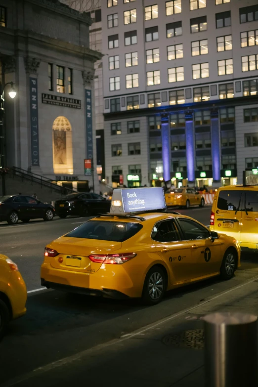 a city street filled with lots of traffic next to tall buildings, by Adam Saks, happening, yellow lighting, madison square garden, thumbnail, [ cinematic