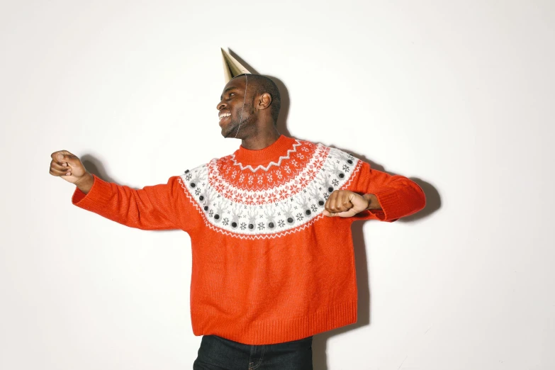 a man wearing a crown on top of his head, an album cover, inspired by Ernest William Christmas, pexels contest winner, red sweater and gray pants, yasuke 5 0 0 px models, celebrating a birthday, inuit