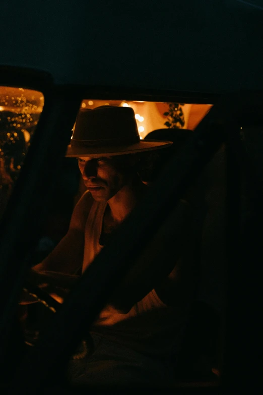 a couple of people that are sitting in a car, unsplash contest winner, australian tonalism, he is wearing a hat, night light, still from a live action movie, high quality photo