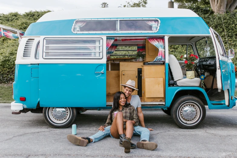 a man and a woman sitting in front of a blue van, pexels contest winner, kitsch movement, hippie pad, avatar image, instagram picture, full body photo