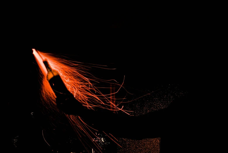 a close up of a person holding a frisbee in the dark, pexels contest winner, art photography, fire hair, red lightsaber, laser wip, from the side
