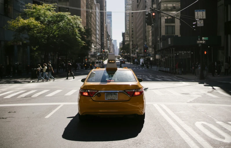 a yellow taxi cab driving down a city street, pexels contest winner, hypermodernism, square, low quality photo, fan favorite, ny