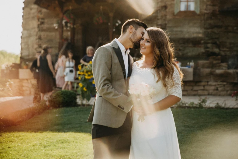 a bride and groom standing in front of a stone building, pexels contest winner, lens flare photo real, rustic, sunny environment, romanian