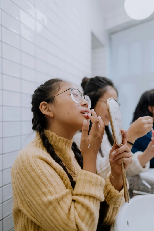 a group of women brushing their teeth in a bathroom, trending on pexels, hyperrealism, young asian girl, profile image, wearing square glasses, - 9