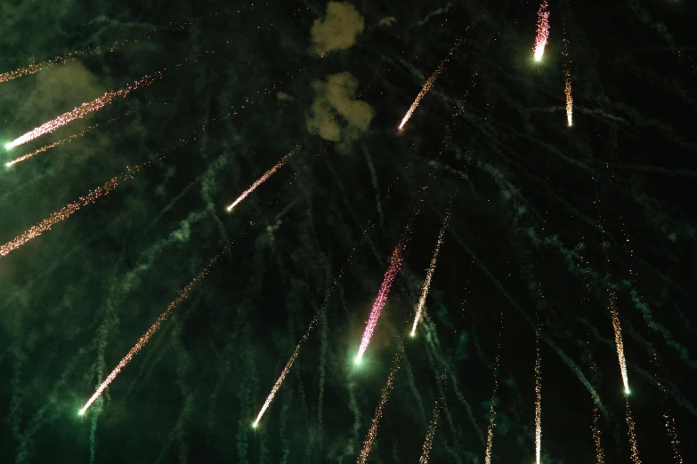 a bunch of fireworks that are in the sky, pexels, hurufiyya, green steampunk lasers, low quality photo, 2000s photo