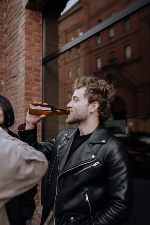 a man in a leather jacket drinking from a bottle, pexels contest winner, renaissance, couple, melbourne, people drinking beer, post malone