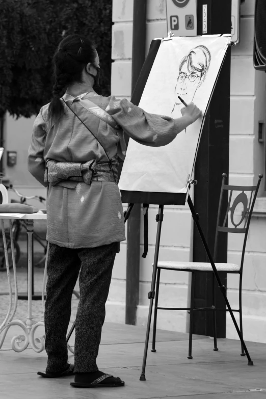 a man that is standing in front of a drawing board, a drawing, inspired by Francesco Hayez, process art, candid street photography, monochrome artwork!!, on artstastion, child drawing