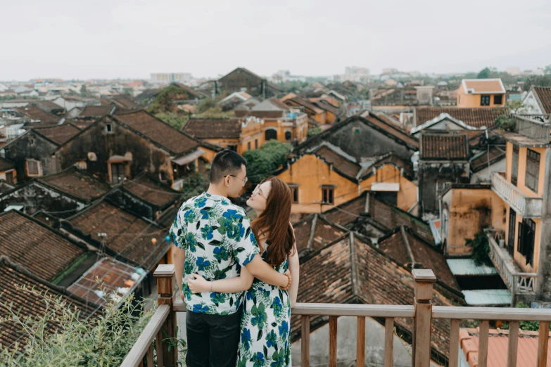 a man and woman standing next to each other on a balcony, a picture, inspired by Ruth Jên, pexels contest winner, happening, tiled roofs, dreamy chinese town, hoang long ly, profile image