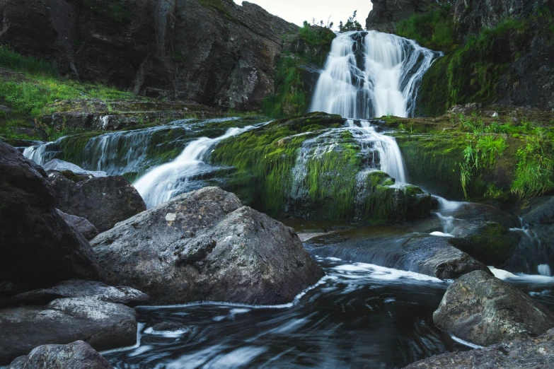 a waterfall in the middle of a lush green forest, unsplash, hurufiyya, wyoming, 2 5 6 x 2 5 6 pixels, wet rocks, icelandic valley