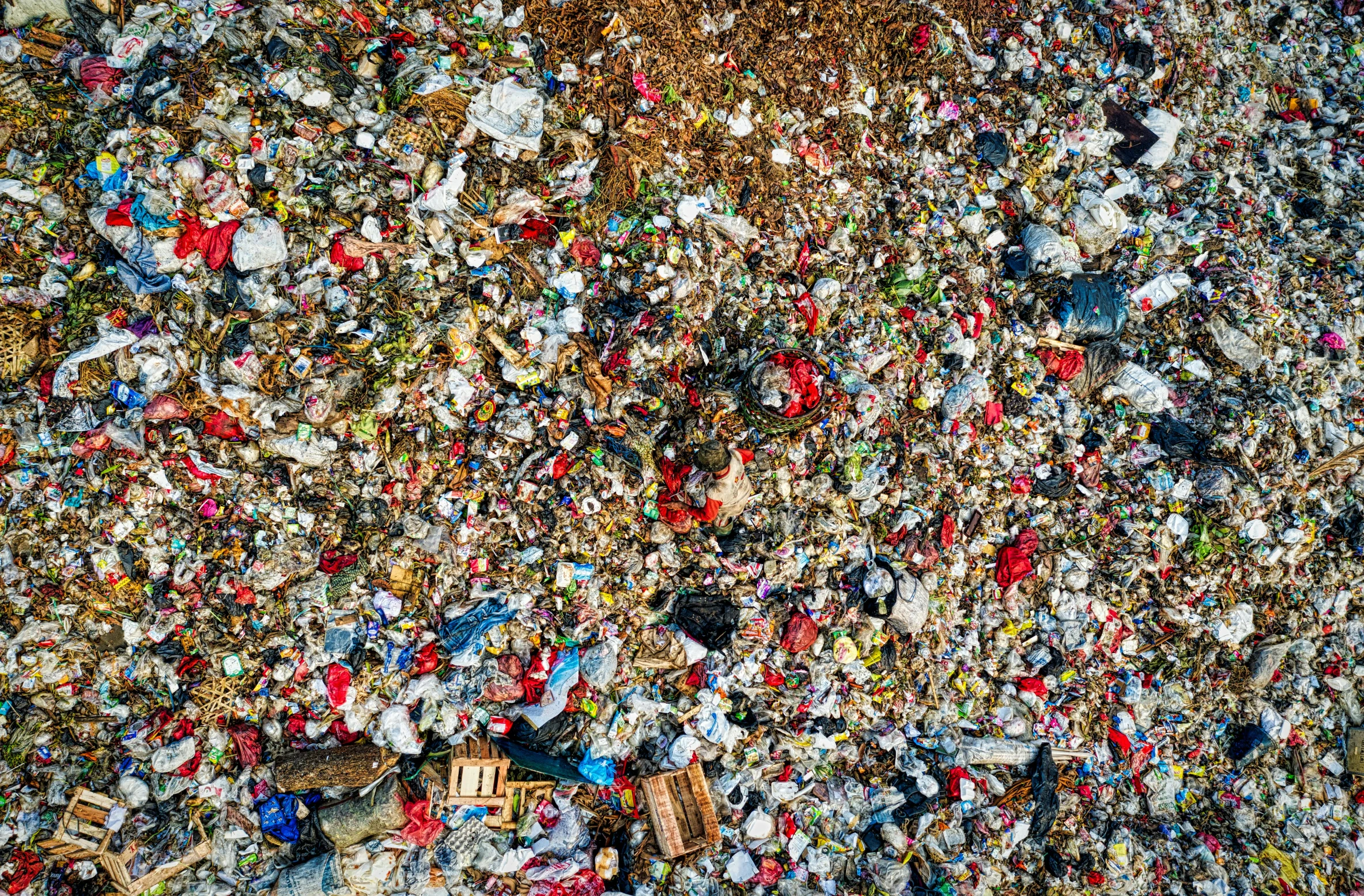 a large pile of garbage sitting on top of a street, an album cover, by Daniel Lieske, pexels, plasticien, drone view, detailed photo 8 k, hillside, 🤬 🤮 💕 🎀