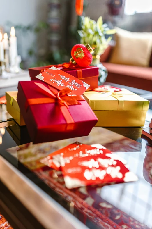 a coffee table with a bunch of presents on it, happening, wearing a red cheongsam, papers on table, medium close shot, square