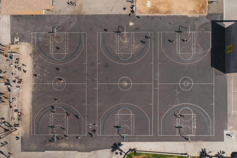 a group of people standing on top of a basketball court, by Paul Bird, unsplash contest winner, helicopter view, los angelos, playground, well drawn