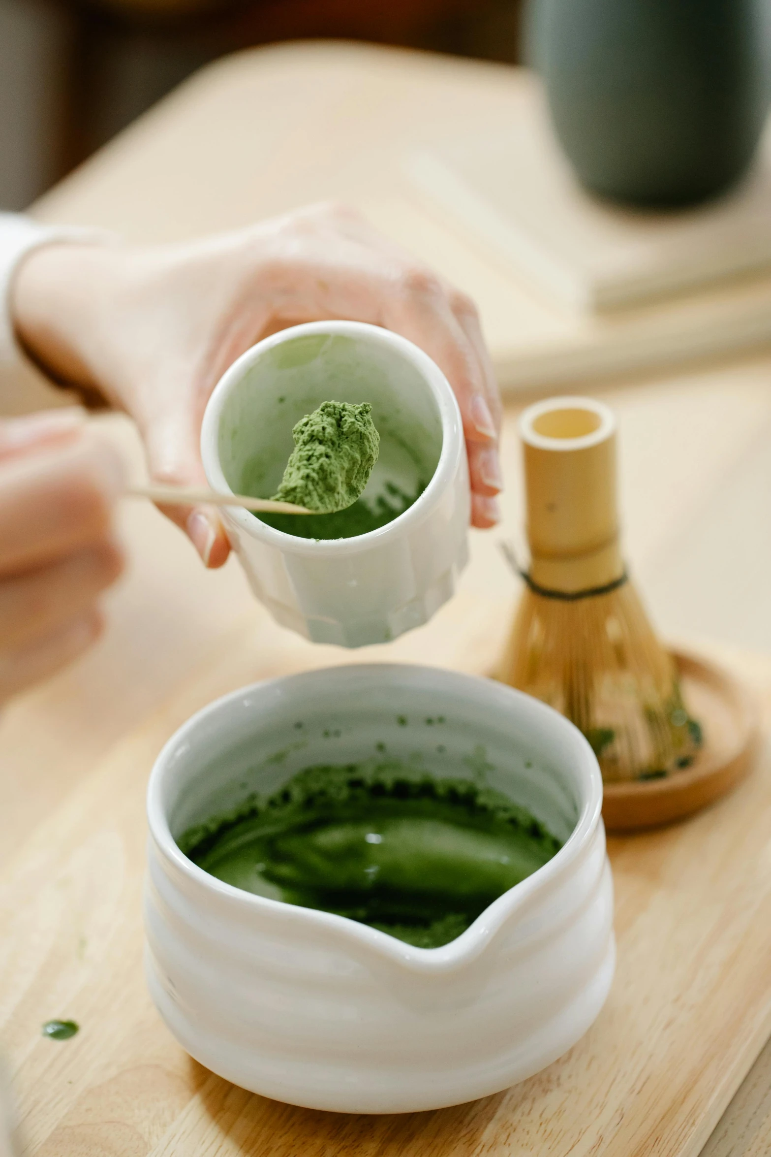 a person pouring a cup of green tea, inspired by Kanō Shōsenin, mortar and pestle, premium, powder, kami