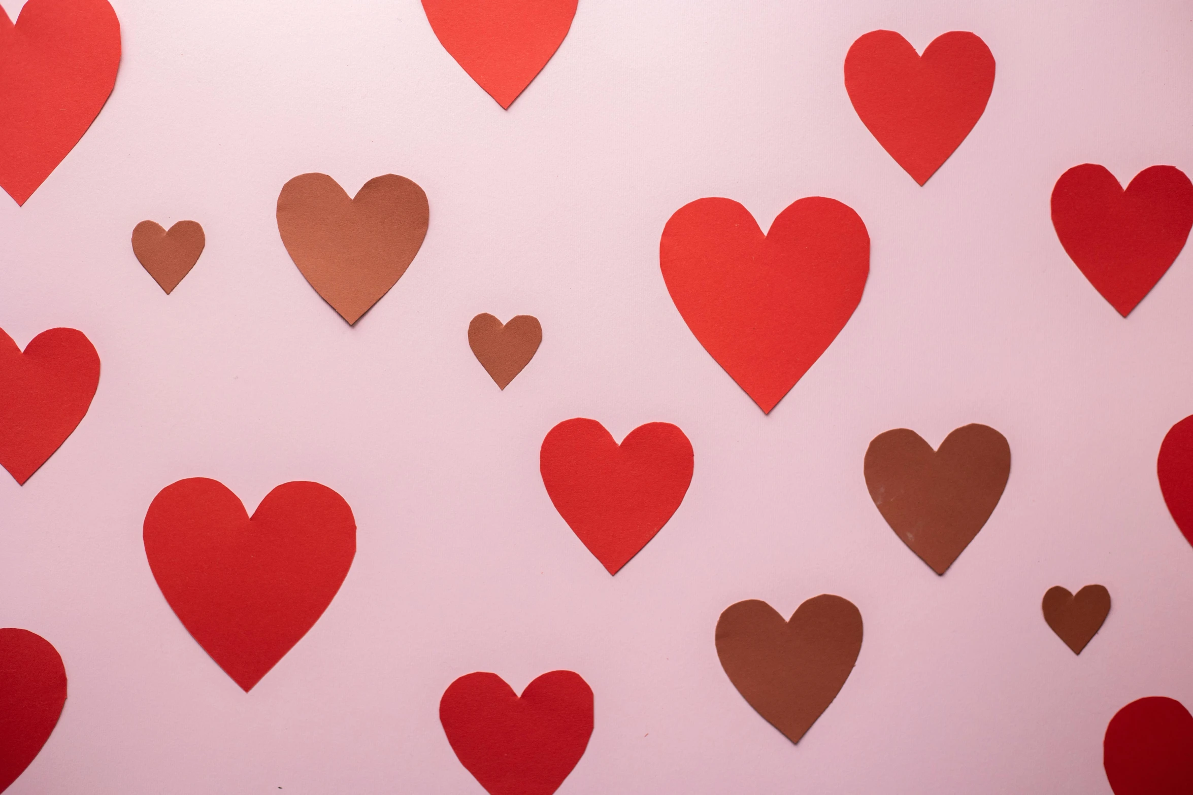 a wall covered in lots of red and brown paper hearts, by Julia Pishtar, trending on pexels, pop art, dull pink background, profile image, chocolate, heart rate