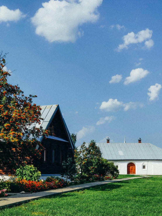 a house sitting on top of a lush green field, slavic, profile image