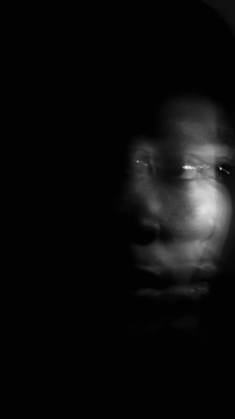 a black and white photo of a man's face, by Adam Chmielowski, conceptual art, photo of a black woman, ghost faces, photograph ”, stable diffusion self portrait